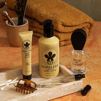 Nopalera skincare products on a wooden tray with towels in the background