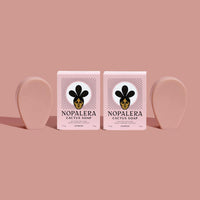 Two Nopalera cactus soap bars on a pink background