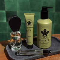 Bosque Misticio and Nopalera products on a tray with a green tiled wall background
