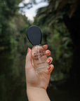 Bosque Místico luxury Mexican fragrance by Nopalera held outdoors in natural setting