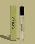 A 10mL Luxury Mexican travel spray bottle perfume - Bosque Místico with a clear liquid visible inside, labeled 'Nopalera Bosque Místico'. The product is accompanied by a green box with the same labeling.
