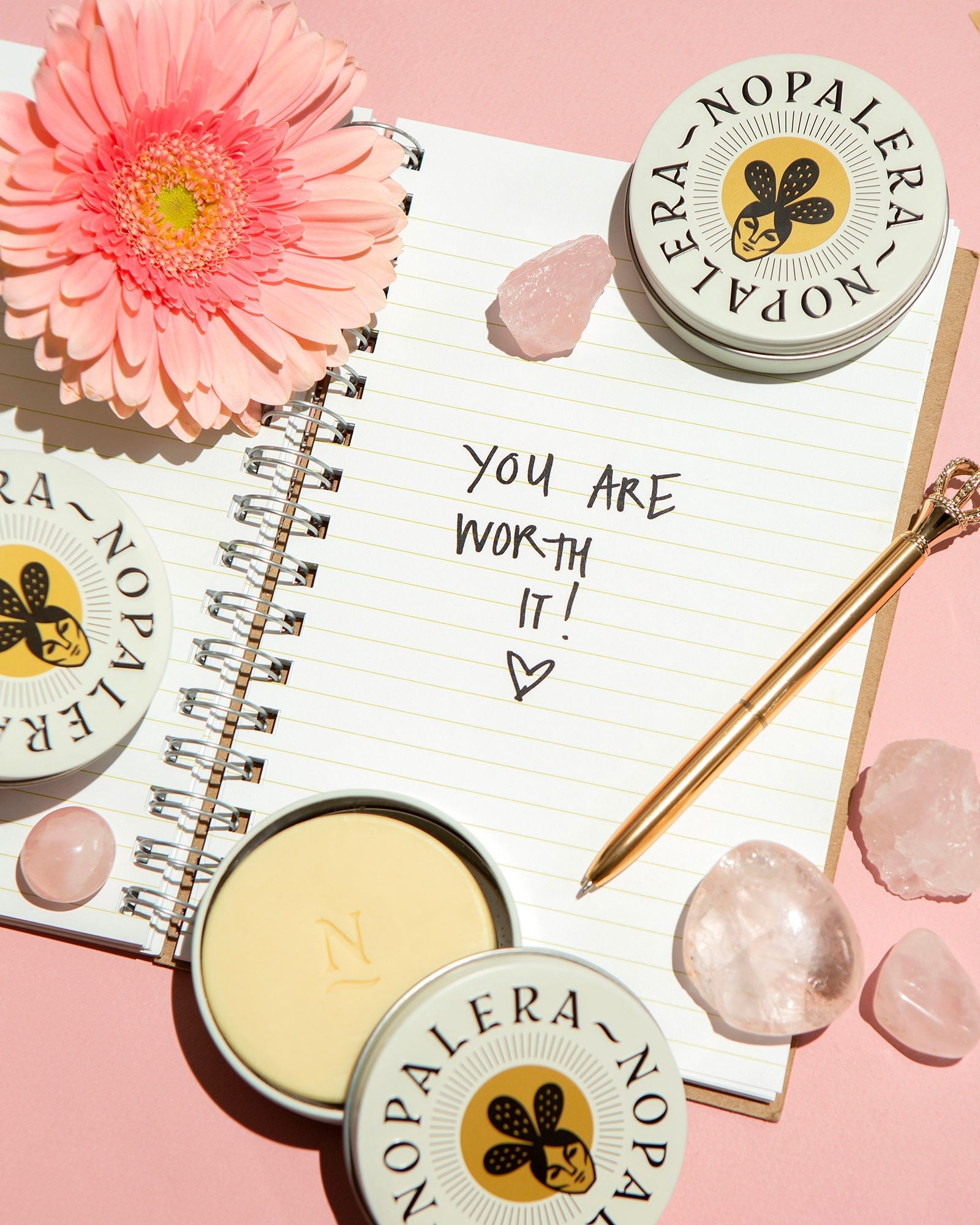 Nopalera Citrus Lotion Bar featured in a self-care flat lay with candle, crystals, flowers, and inspirational journal accents