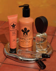 Set of Nopalera skincare products on a tray with a warm-toned background