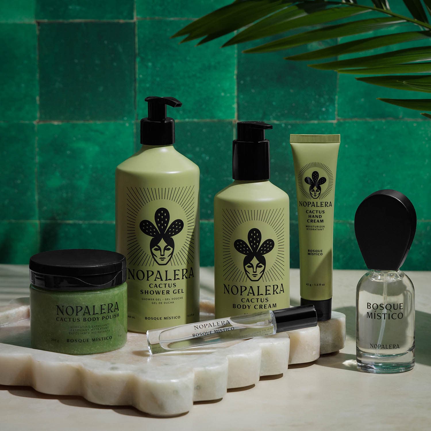 Nopalera body care and fragrance collection featuring cactus body polish, shower gel, body cream, hand cream, and Bosque Místico perfume.