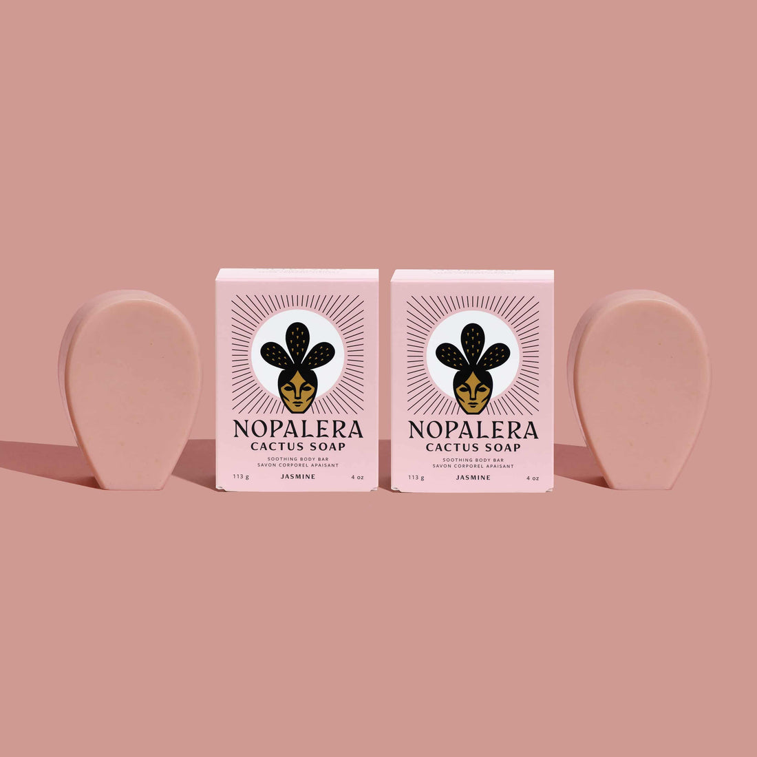 Two Nopalera cactus soap bars on a pink background