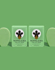 Two bars of lemongrass cactus soap with packaging, green background.