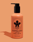 Nopalera cactus body cream bottle in Flor de Madera scent on a peach background.