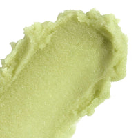 Close-up of  nopalera bosque místico body polish on a white background