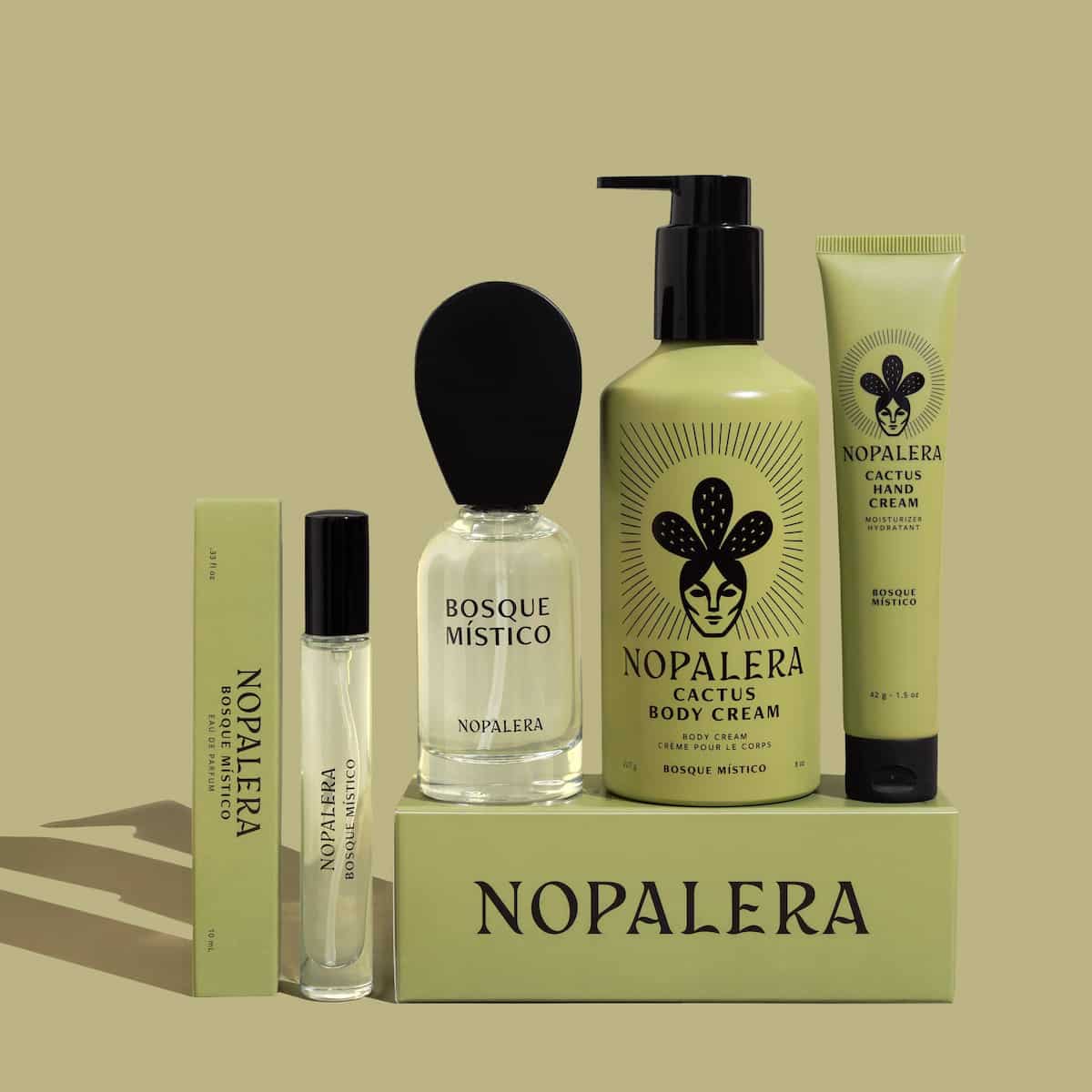 Nopalera skincare products including a 50ml perfume, hand cream, body cream, travel spray perfume on a green background