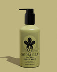 A green pump bottle of Nopalera Bosque Místico Body Cream with a graphic of a cactus and the text 'Bosque Místico' on the label.